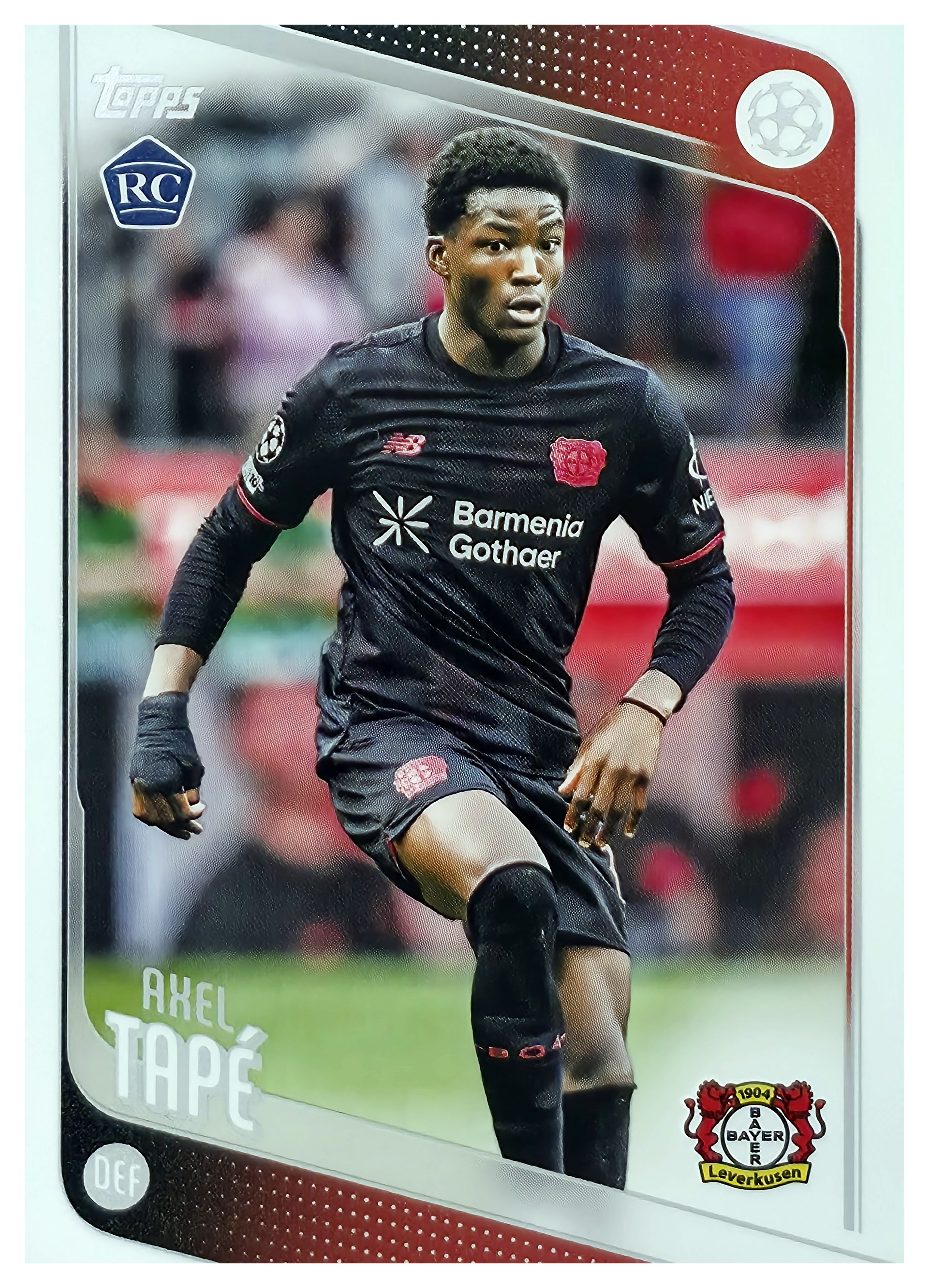 Axel Tapé - Topps UEFA Club Competitions Base Set 2025-26, Nr. 9 – Rookie Card (Art.-Nr. SG107683)